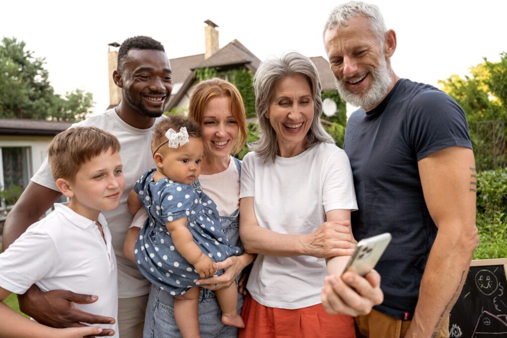 Big family staring at the phone