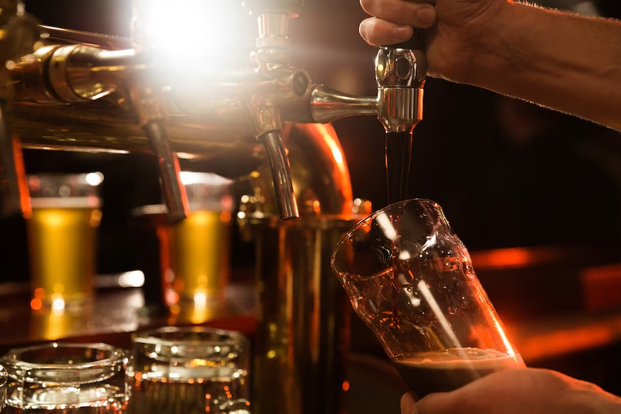 Person using a drink-making machine