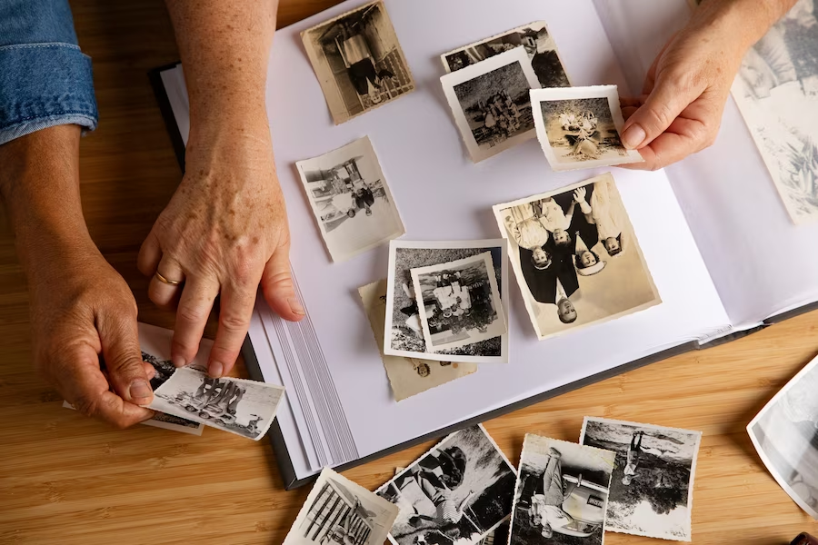 Hands holding vintage photographs